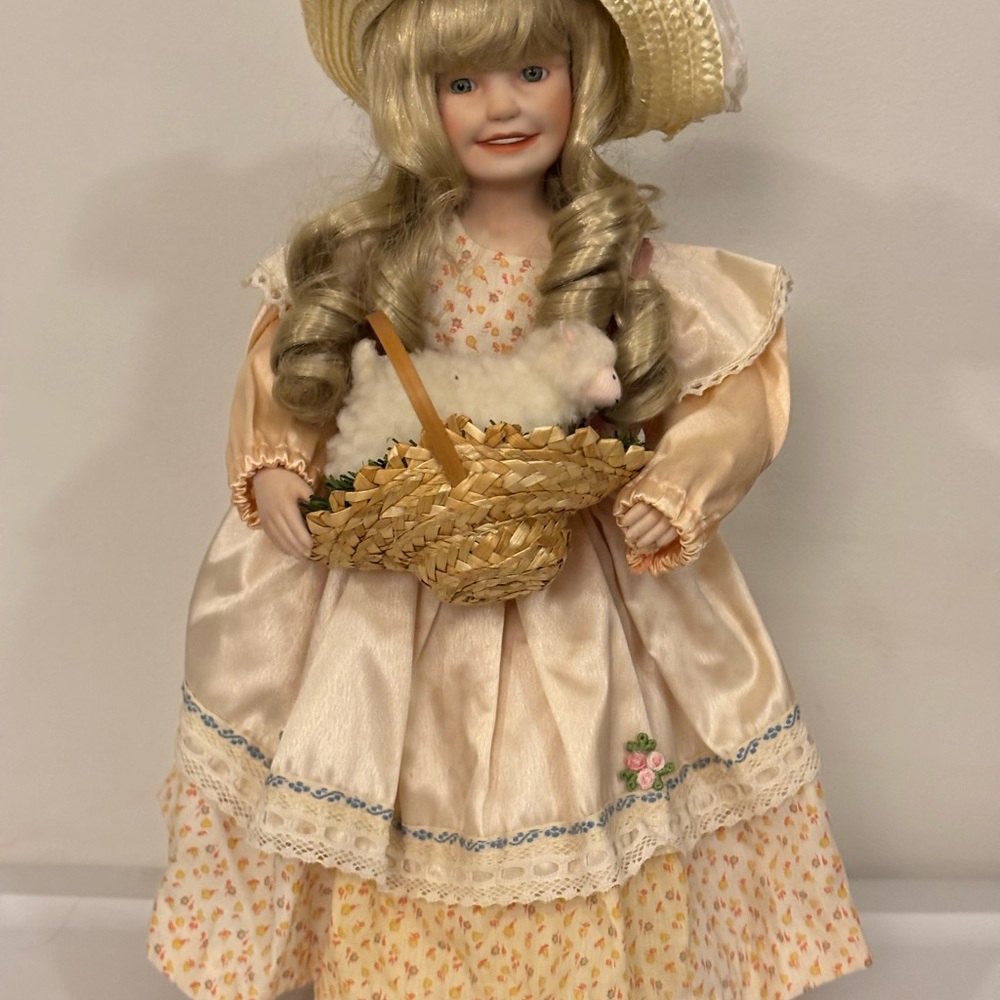 Adorable Porcelain Doll with Straw Hat and Basket
Little Bo Peep